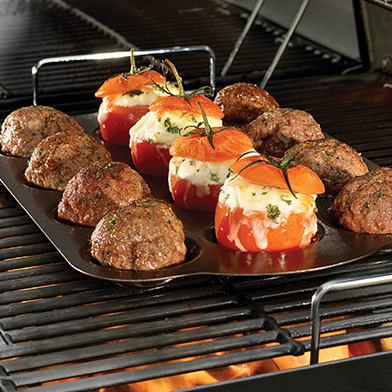 Grill roasted tomatoes and meatballs on a grill