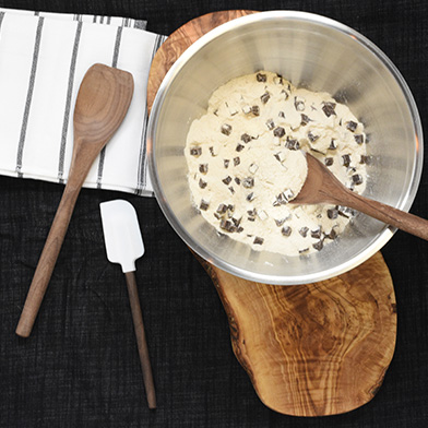 Cookie dough mix cookie dough mix in a bowl with wooden spoon