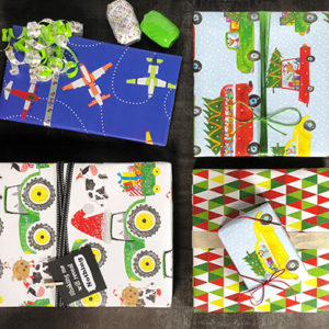 An assortment of gifts wrapped in tractor and airplane wrapping paper