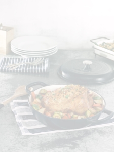 cast iron pan with chicken and vegetables