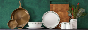 A green wall serves as a backdrop for a green table set with white plates, creating a harmonious and fresh dining atmosphere.