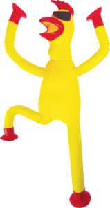 A cheerful yellow rubber chicken with red suction hands and feed and stylish sunglasses