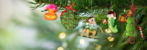 A beautifully adorned Christmas tree featuring an array of colorful decorations hanging from its branches.