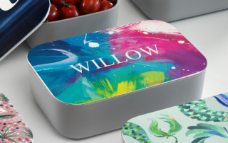 A collection of uniquely designed personalized lunch boxes, perfect for a fall school fundraising event.